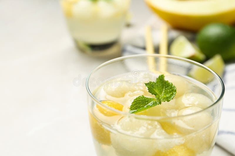 Glass of Melon Ball Cocktail with Mint on , Closeup Stock Photo Image