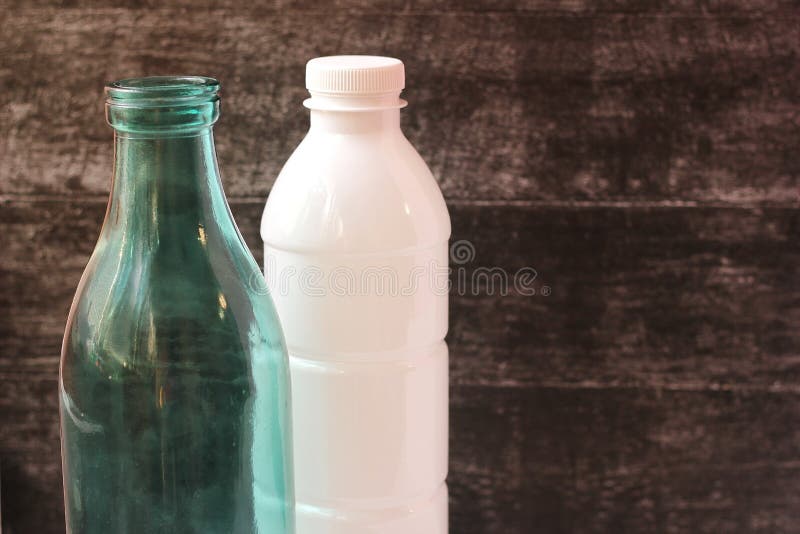 Glass Milk Bottle and Plastic Bottle. Reusable Packaging. Empty Space