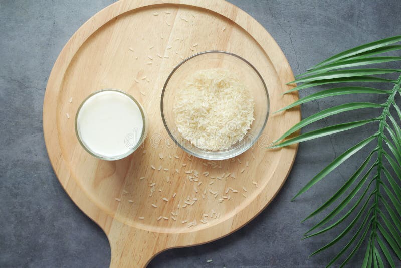 Glass of Milk and Rice on a Table, Non Dairy Milk Concept Stock Image