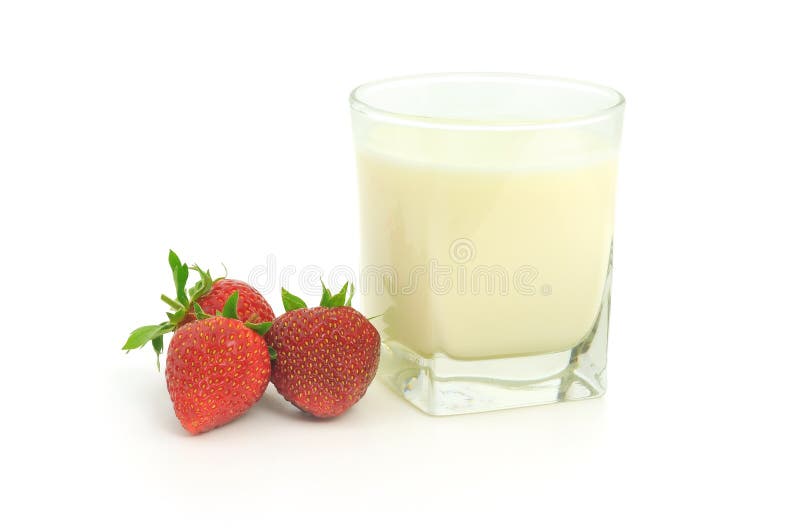 Glass of milk and strawberries