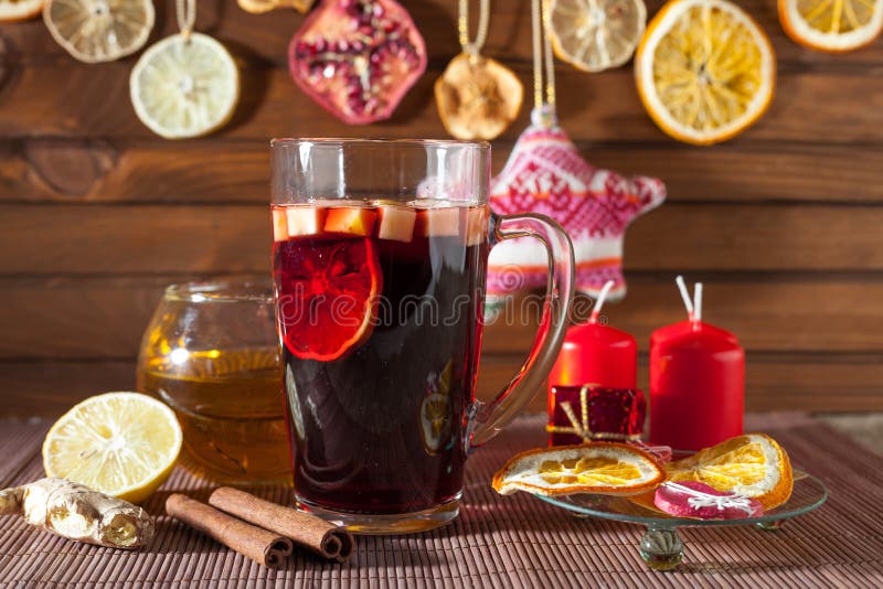 Glass Of Mulled Wine And Christmas Decorations, Candles, Gifts Stock ...