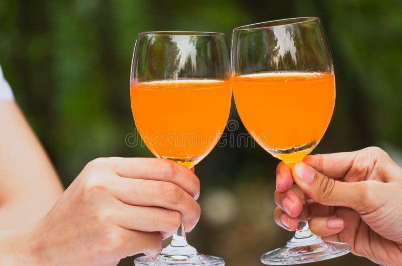 Orange juice in wine glass stock photo. Image of club 22843624