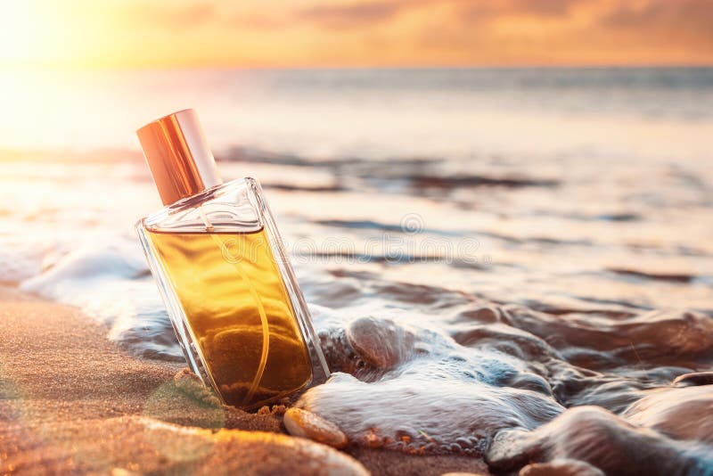 Premium Photo  Blue perfume bottle mock up stands on wet sand on the  background of waves and the sea on the beach