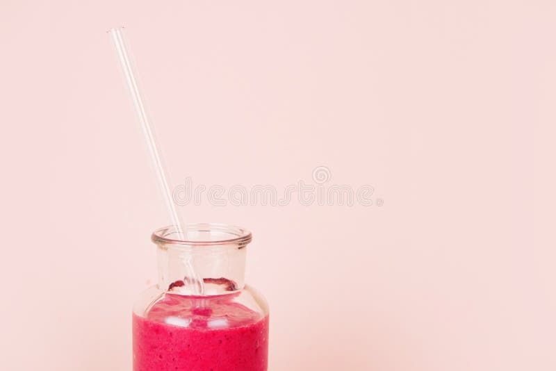 Glass of Pink Drink with Glass Drinking Straw. Stock Photo Image of