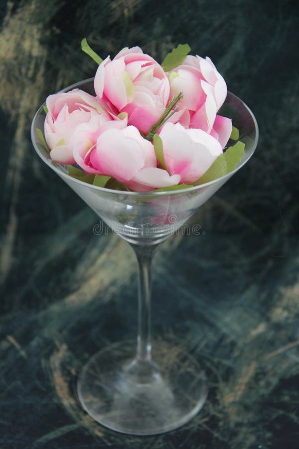 Glass with pink flowers stock image. Image of rose, flowers 259094173