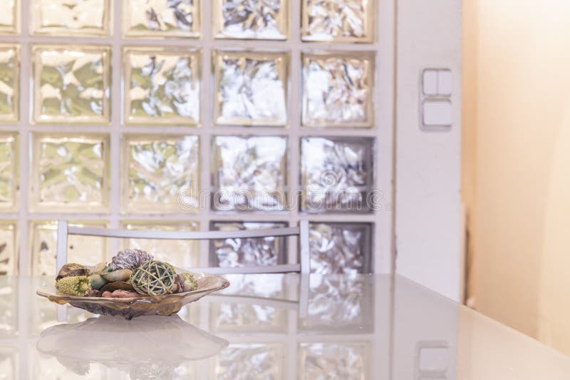 Glass Plate Centerpiece on White Gloss Table and Skylight Stock Photo