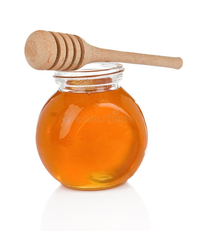 Sweet Honey in Glass Jars with and Bottle of Milk Iso Stock