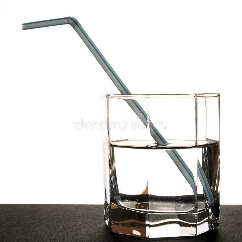 Glass of pure water with a straw for a cocktail