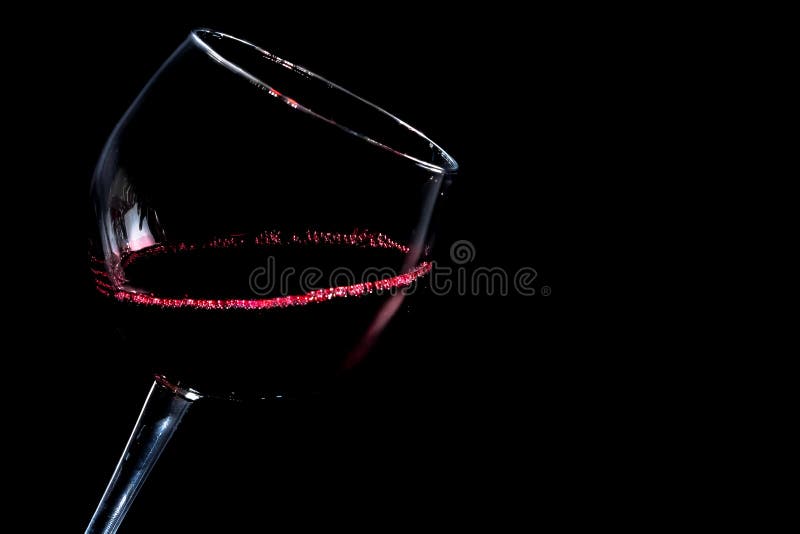 A glass of red wine on black background with space for text. Window color reflection background stock images, royalty-free photos and pictures