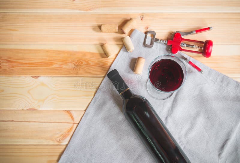 Glass of red wine, bottle of wine, wine corks and corkscrew stock photography Glass of red wine, bottle of wine, wine corks and corkscrew stock photography