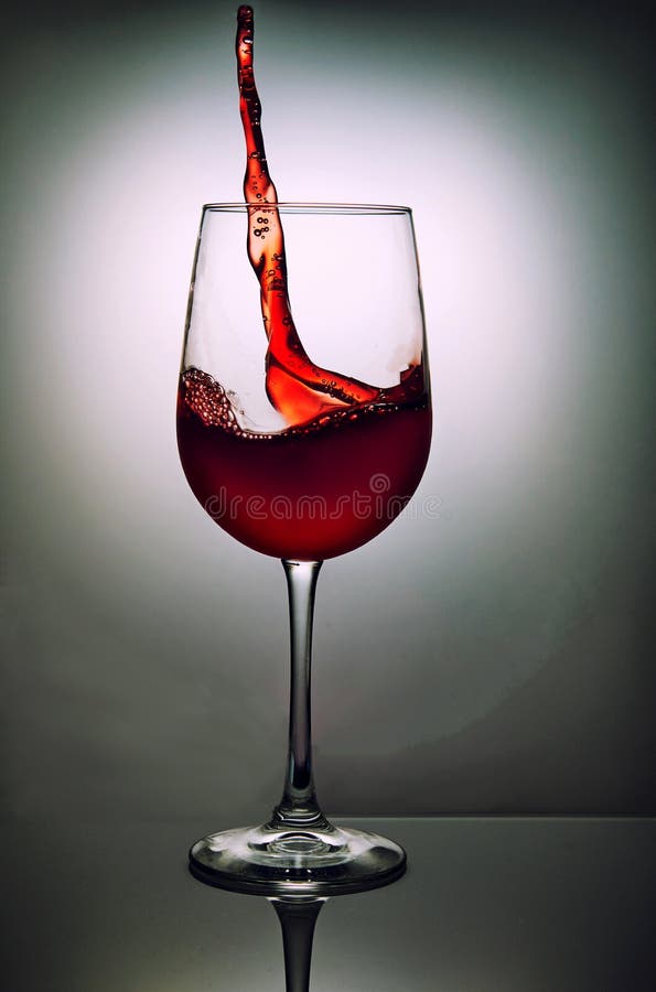 Glass Of Red Wine With Wave On Grey Background Stock Photo Image of