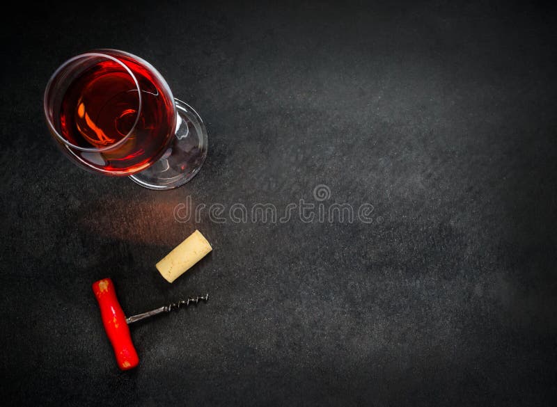 Glass of Rose Wine with Corkscrew and Copy Space Area