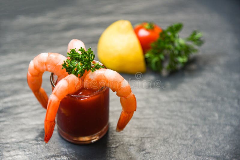 Glass shrimp cocktail in tomato sauce / Shellfish seafood boiled Shrimps prawns ketchup