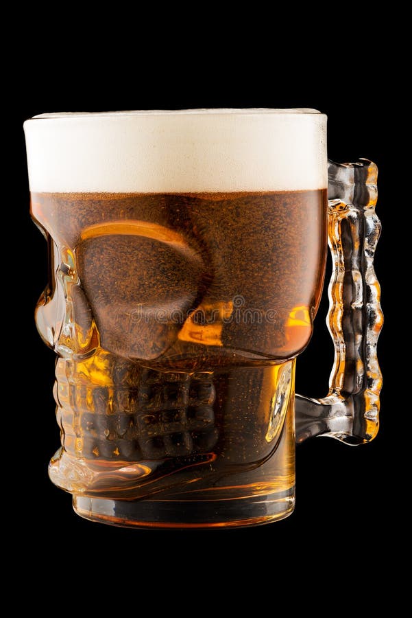 Glass Skull Shaped Mug with Beer Isolated on Black Background Stock