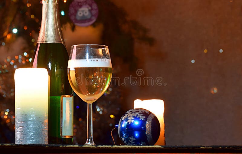 A Glass of Sparkling Wine between Two Candles Stock Image Image of