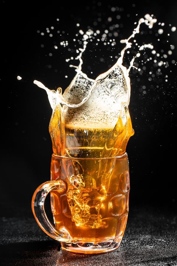 Glass of Splashing Beer. Freeze Motion Splash Drops of Beer Foam Stock Photo Image of drop
