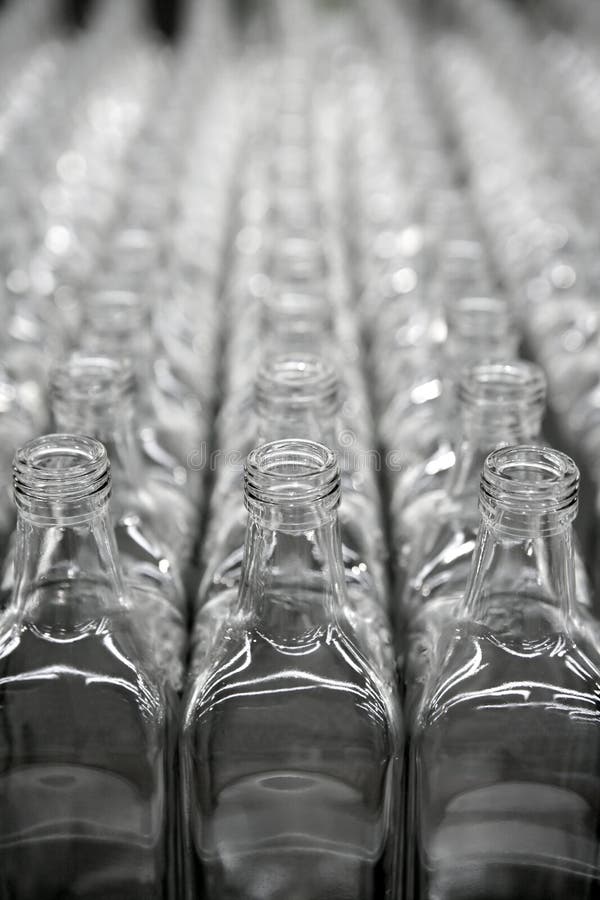Glass square transparent bottle rows royalty free stock photography