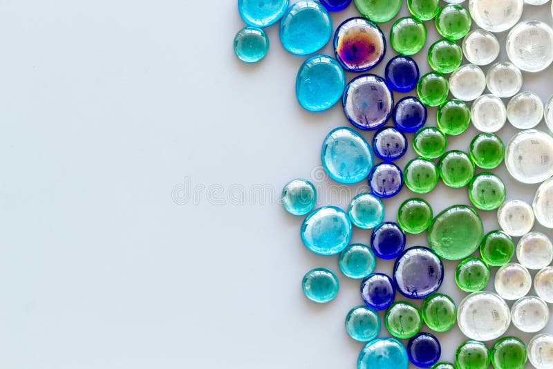 Glass Stones for Design and Home Creativity on Gray Background Top View