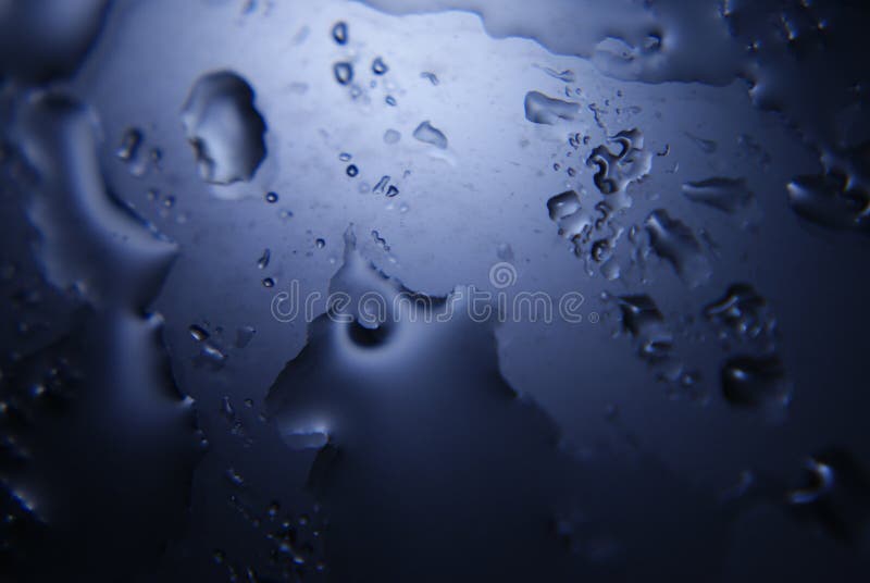 Glass surface with splashed water drops royalty free stock photos