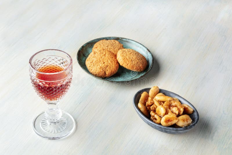 A Glass of Sweet Wine with Biscuits and Nuts Stock Photo Image of