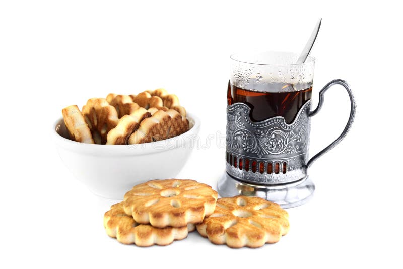 Glass of tea and cookies stock image. Image of holder 19570047