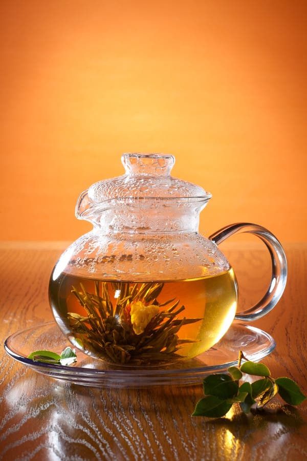 Glass teapot with greean tea