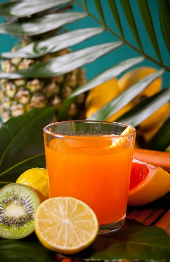 Glass of Tropical Exotic Multifruit Juice with Pineapple, Fruits and ...