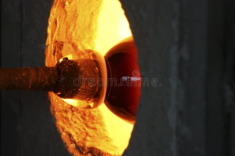 The tallent of glassblowing in a hot oven. The tallent of glassblowing in a hot oven