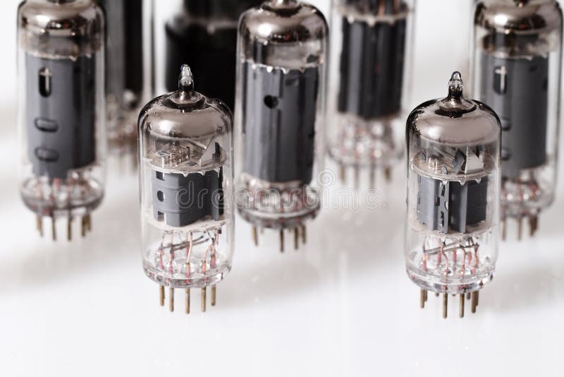 Glass vacuum radio tubes stock image. Image of mirroring 34098885
