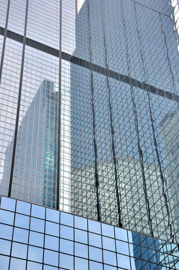 Glass wall and reflection of modern buildings