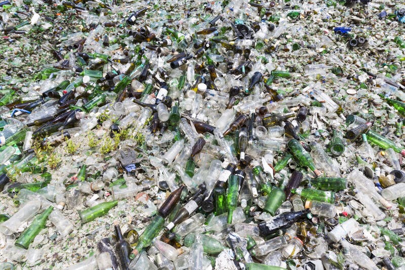 Glass Waste in Recycling Facility. Pile of Bottles. Stock Photo Image