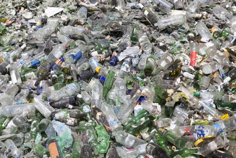 Glass Waste in Recycling Facility. Pile of Bottles. Stock Photo Image