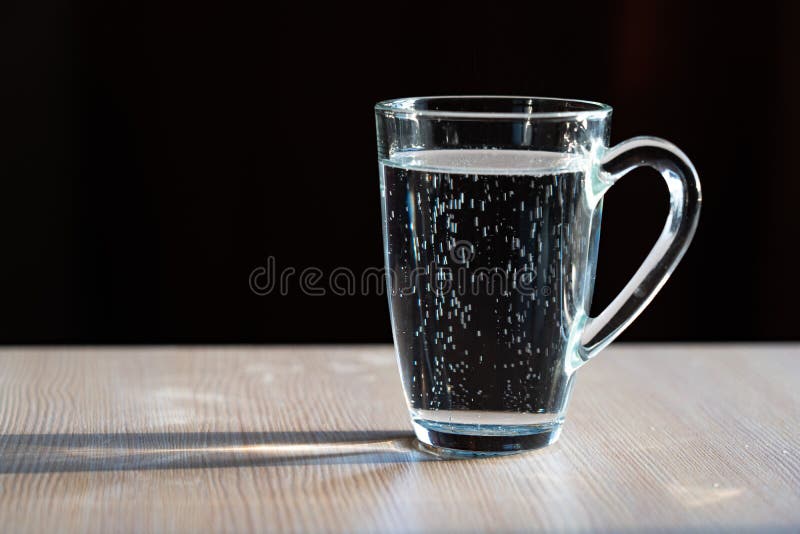 Glass Of Water In A Glass Mug Stock Photo, Picture and Royalty