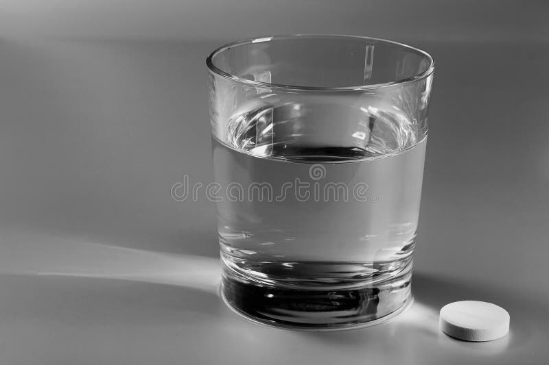 Glass of water and an effervescent pill