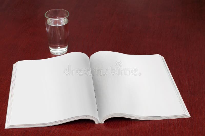 Glass of water with a magazine