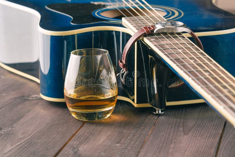 Glass of Whiskey on the Table and Guitar Stock Image Image of blue