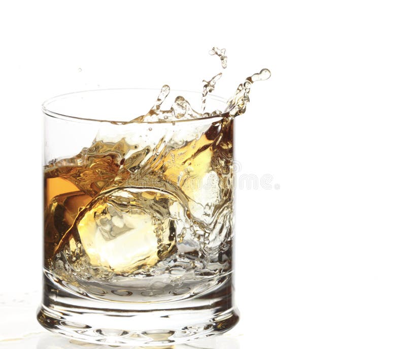 A Glass of whisky with ice cube splash royalty free stock photography A Glass of whisky with ice cube splash royalty free stock photography