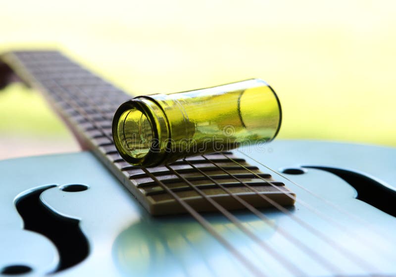 Glass Wine Bottleneck Guitar Slide Stock Photo - Image of flower