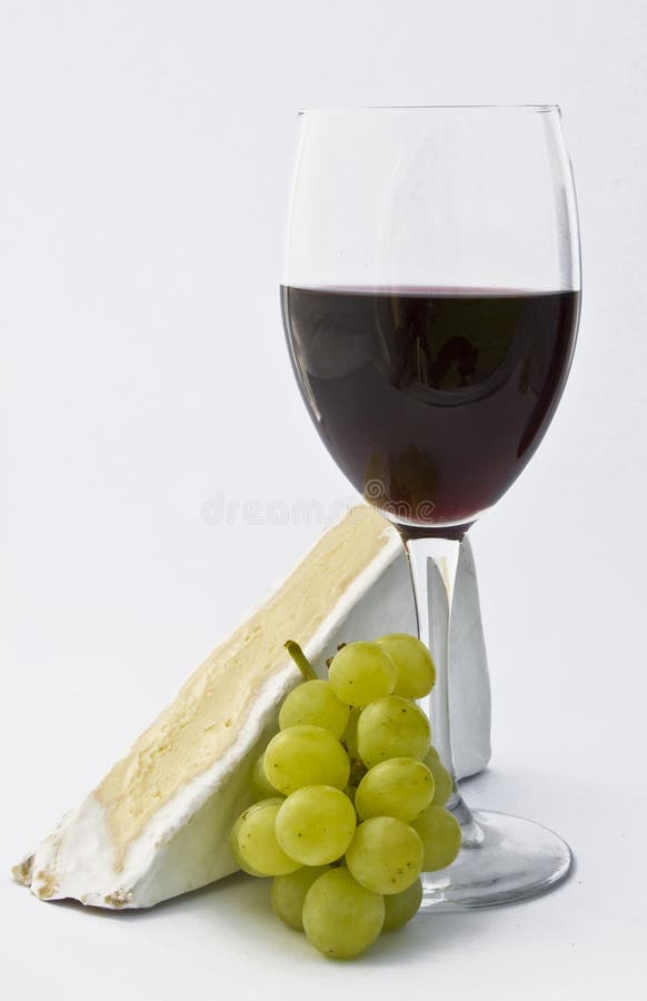 Glass of wine with grapes and cheese