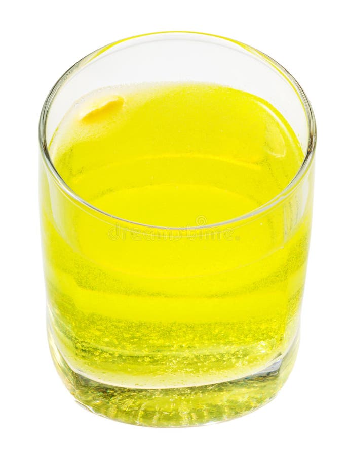 Glass of yellow carbonated water with vitamin C