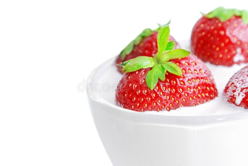 Glass of yogurt with strawberries royalty free stock photo