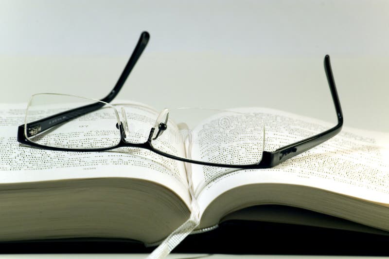 Glasses on a book stock image. Image of reading, read 4308579