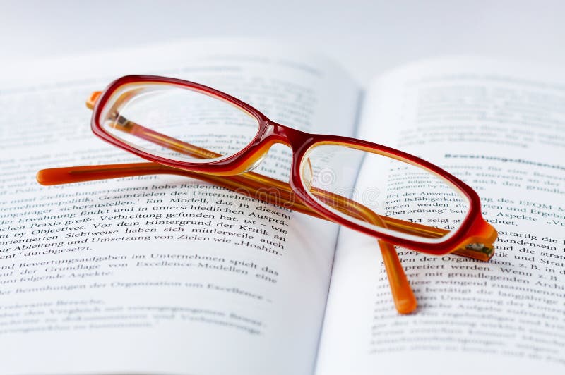 Glasses on a book stock image. Image of time, book, reading 9494365