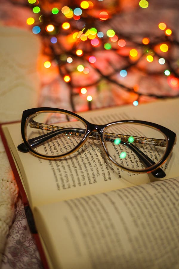 Glasses on book stock image. Image of cover, bokeh, closeup 172680659