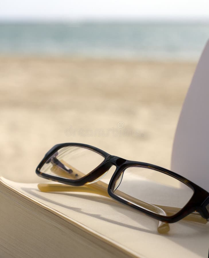 Sunglasses and Book on Beach Chair Stock Image Image of coast, escape