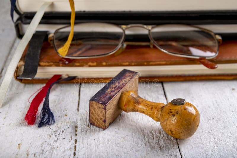 Glasses and Books with Tabs Made of String. Old Publications and a