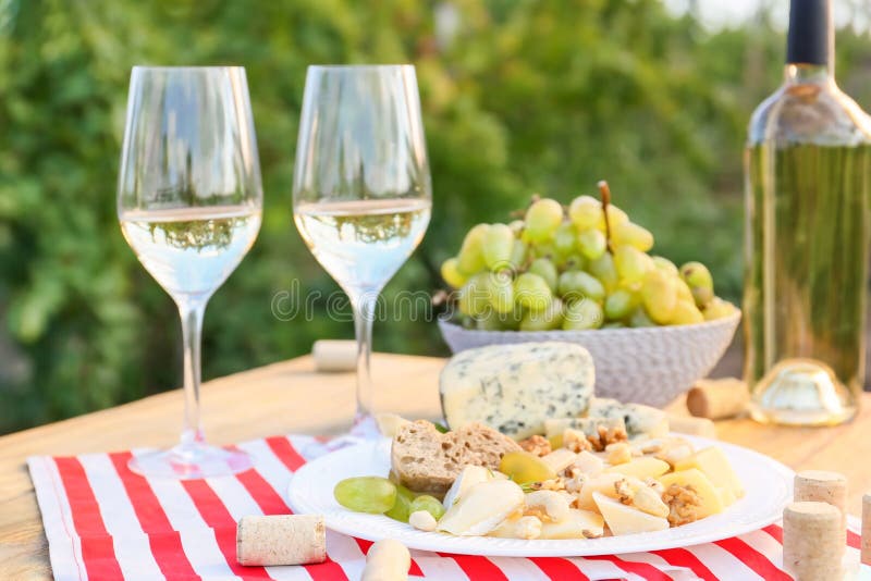 Glasses and Bottle of White Wine with Snacks on Table in Vineyard Stock Image Image of napkin