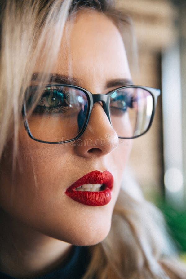 Glasses eyewear woman portrait looking away. Close up portrait of female.