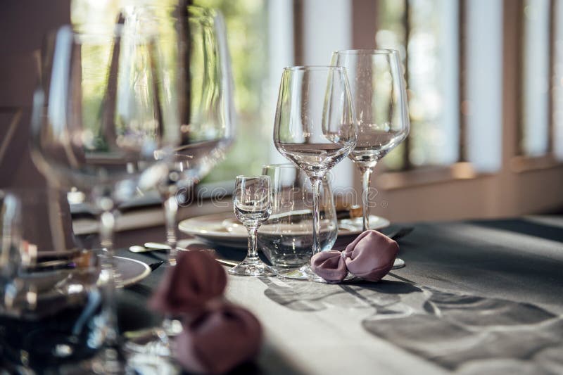 Glasses, Flowers, Fork, Knife Served for Dinner in Restaurant with Cozy ...