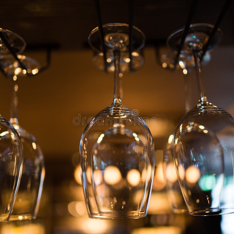 Glasses hanging over bar rack